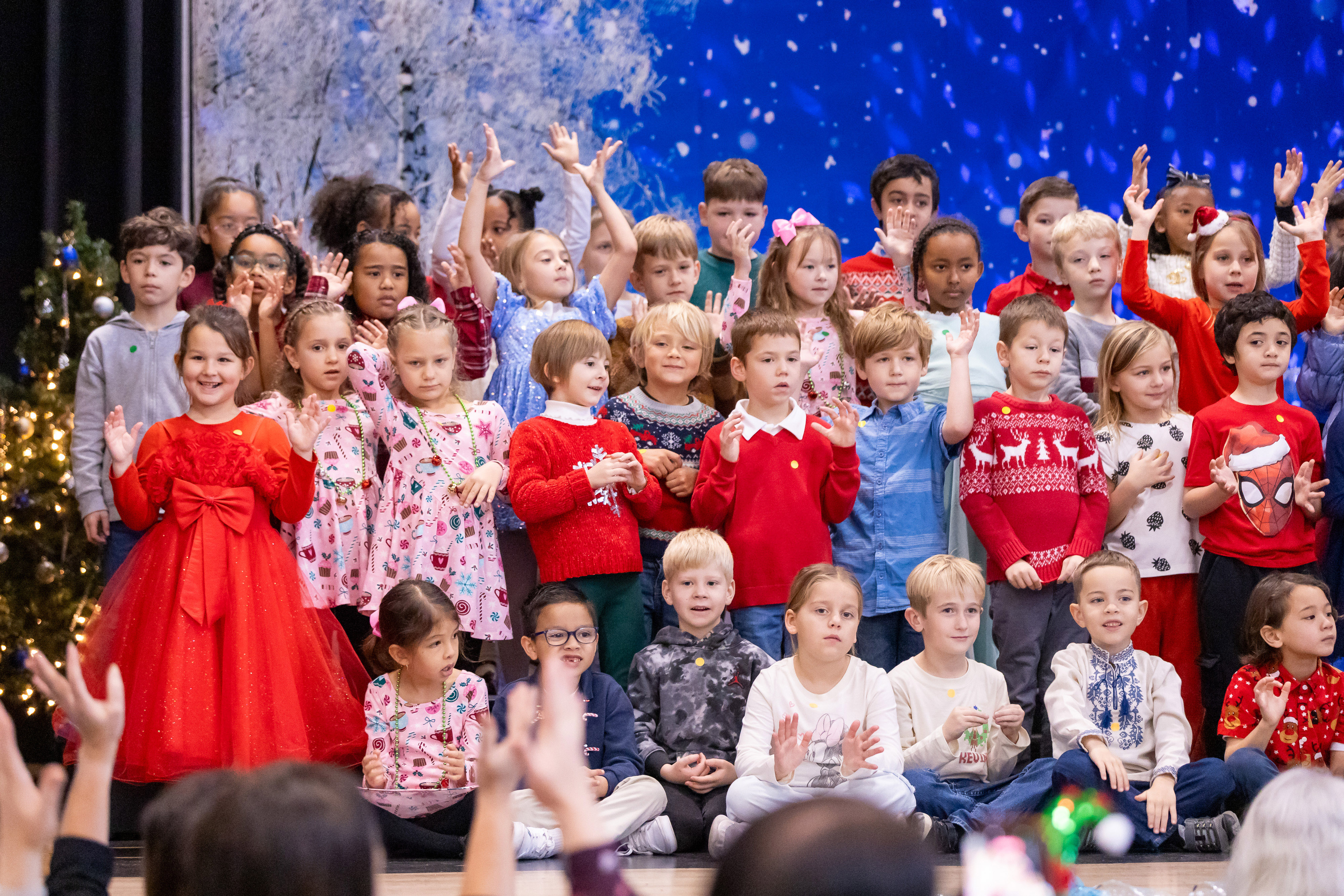 Students singing on stage