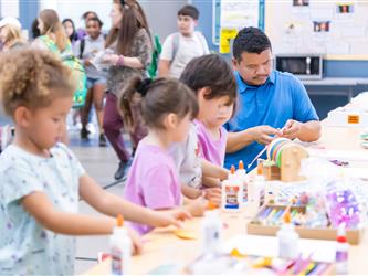 students at table with crafts
