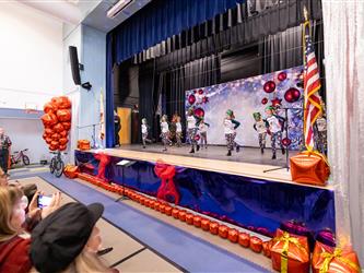 students performing on stage