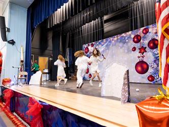 students performing on stage