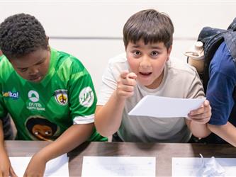 students at table with crafts