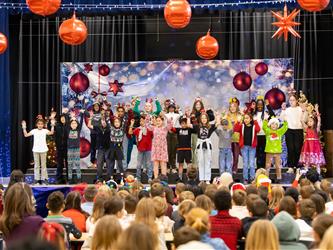 students on stage performing