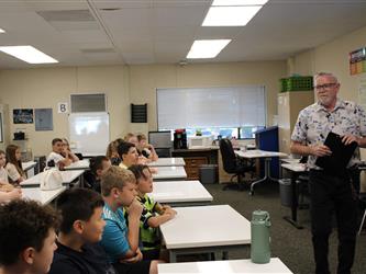 students listening to teacher in class