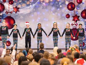 students performing on stage