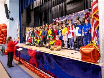 students standing on stage