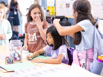 students at table with crafts