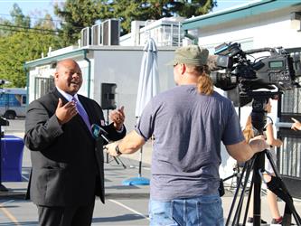 superintendent speaking with camera crew