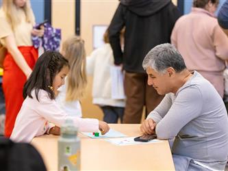 students and guests interacting with activities