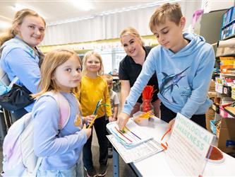 students and guests interacting with activities