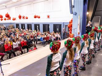 students performing on stage