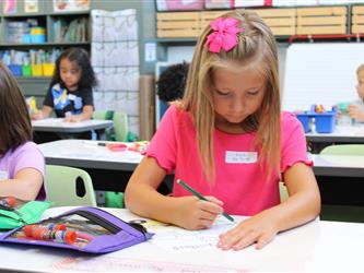 student engaged in drawing activity