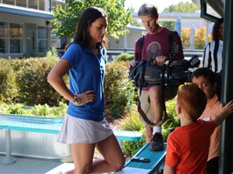 news team speaking with students