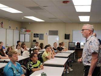 teacher addressing his class