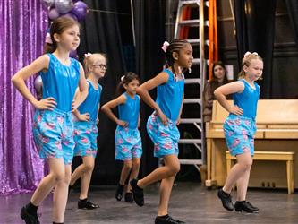group of performers dancing