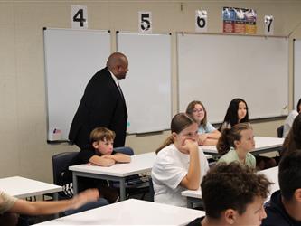 teacher addressing his class