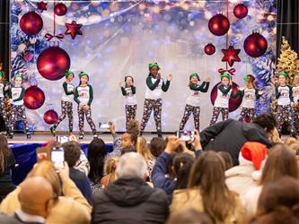 students performing on stage