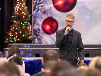 gis principal speaking into microphone