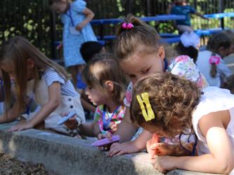 students blowing bubbles