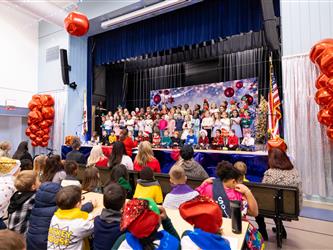 students performing on stage