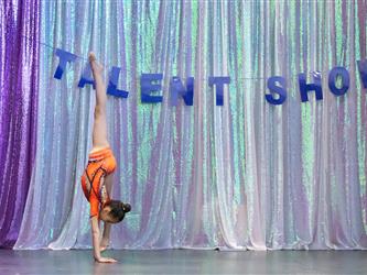 student performing gymnastics on stage