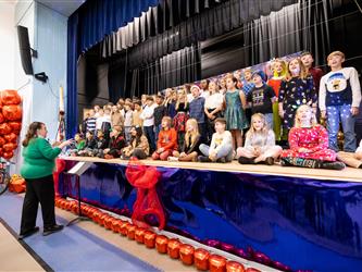 students on stage performing