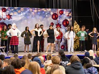 students performing on stage