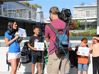 news team speaking with students