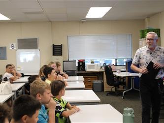 students listening to teacher in class