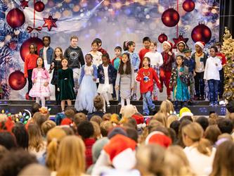 students on stage performing