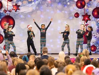 students performing on stage
