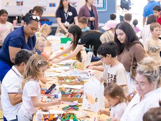 wide shot of children making crafts