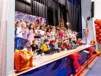students performing on stage