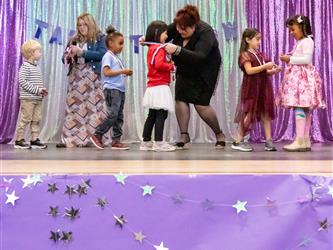 performers walking on stage to receive awards