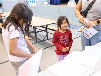 students and guests interacting with activities