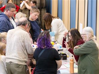 students and guests interacting with activities