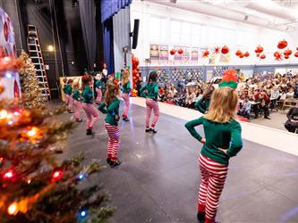 students performing on stage