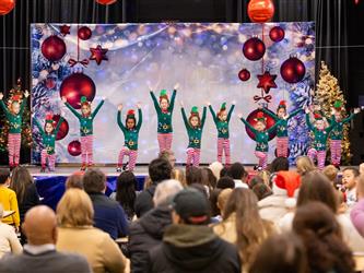 students performing on stage