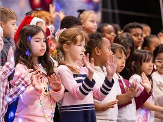 students performing on stage