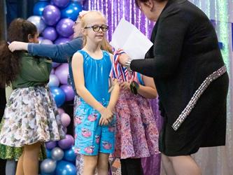 performers walking on stage to receive awards