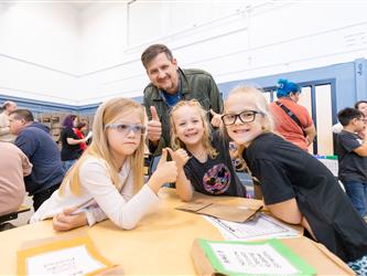students and guests interacting with activities