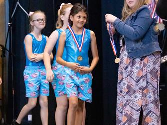 performers walking on stage to receive awards