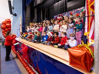 students performing on stage
