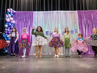 group of performers dancing