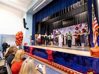 students performing on stage