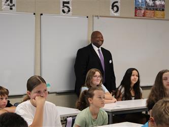 teacher addressing his class