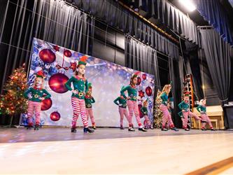 students performing on stage
