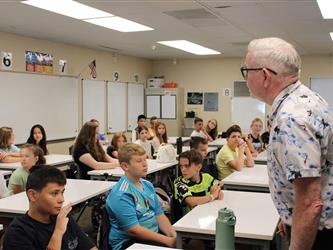 teacher addressing his class