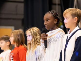 students on stage performing