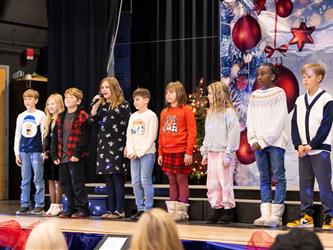students performing on stage