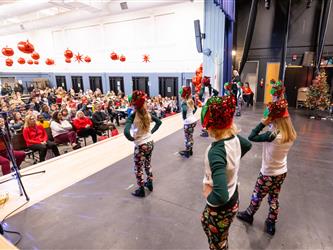 students performing on stage